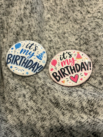 Custom DC Print Haus button pins featuring colorful, artistic designs on metal with pin backs for accessories and decoration.