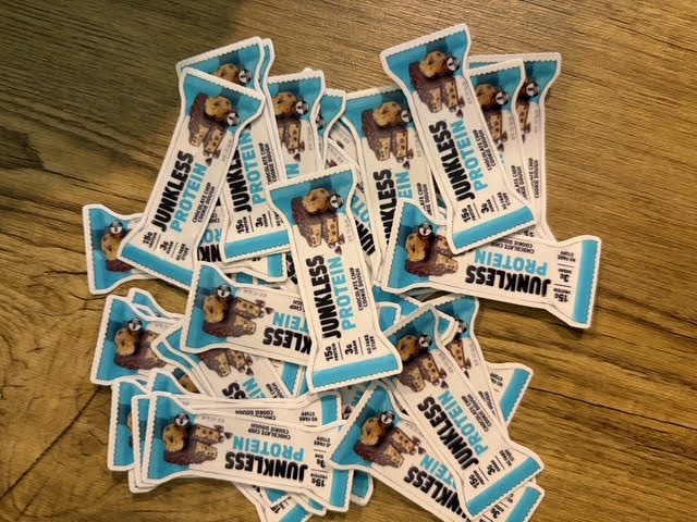 Set of custom 2-inch waterproof vinyl stickers featuring DC Print Haus branding and vibrant designs in a bulk sticker deal.